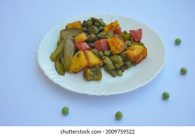 Flat Lay Of Matar Paneer Mix Veg Recipe (Indian Food) Over White Background 