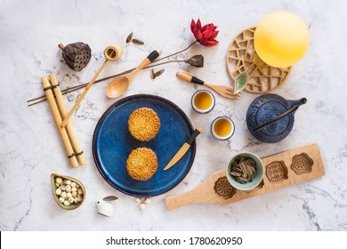 Flat Lay Mid Autumn Festival Snack And Drink, Moon Cake And Chinese Tea Set On Marble Background Still Life Image.