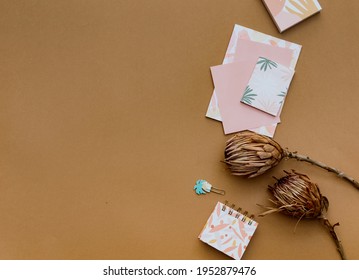 Flat lay minimal composition. Creative concept dry flowers and invitation cards. Top view, copy space