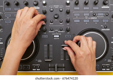 Flat Lay Of Mixing Board. Close-up Shot Of Woman Hands Using Musical Device, Touching Buttons