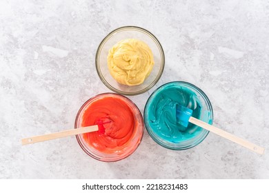 Flat Lay. Mixing Red And Blue Food Coloring Into The Cake Dough.