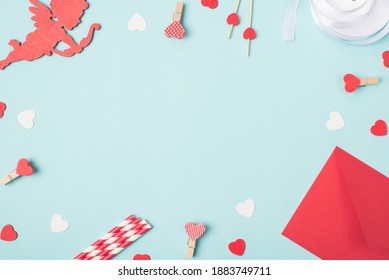 Flat lay mock up photo image of lovely cupid pins with red and white hearts envelope on pastel blue table backdrop - Shutterstock ID 1883749711