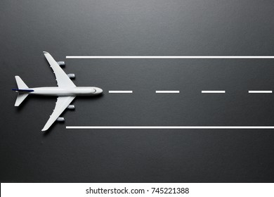 Flat Lay Of A Model Airplane On A Runway