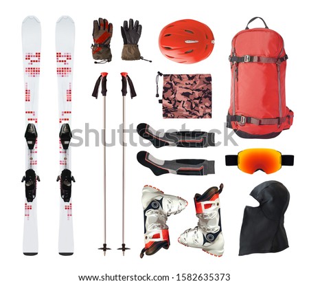 Flat lay of mountain ski equipment and alpine accessories. Helmet, boots, ski goggles, etc. isolated on white background