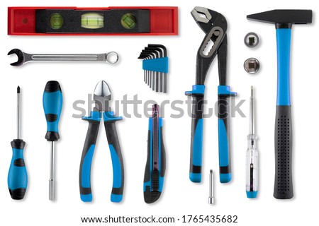 Flat lay with multiple work tools on white background with a soft shadow.