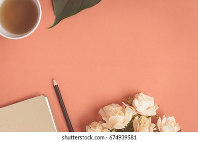 Flat lay Notebook and rose placed on a red desk with write text and vintage tone