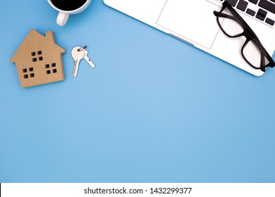 flat lay Office desk table of modern workplace with laptop on blue table, top view laptop background and home wooden, blue desk office with laptop, home sale office desk concept,