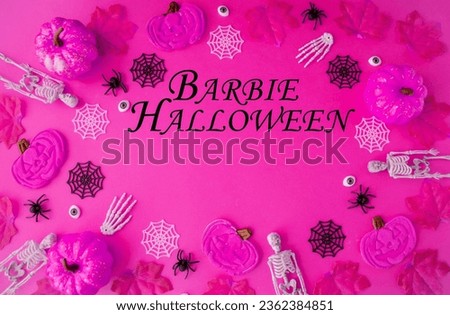 Flat lay, on a pink background, an invitation to a party in the style of Barbie Halloween.  Pumpkins, skeletons, cobwebs, spiders lie in a circle, frame.  View from above.  Halloween holiday concept.