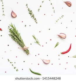 Flat lay overhead top view of greens herbs and spices on white background with copy space. Menu frame design food pattern background with cooking ingredients