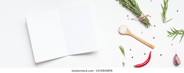 Flat Lay Overhead View Blank Notebook Pages Mockup Text Space Invitation Card On White Background With Greens Herbs And Spices. Menu Or Recipe Book Or Food Blog Design With Cooking Ingredients