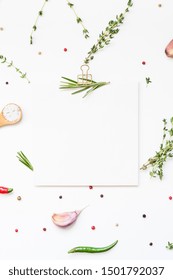 Flat Lay Overhead View Blank Recipe Paper Page With Clip Mockup Text Space Invitation Card On White Background With Greens Herbs And Spices. Menu Recipe Book Food Blog Design With Cooking Ingredients