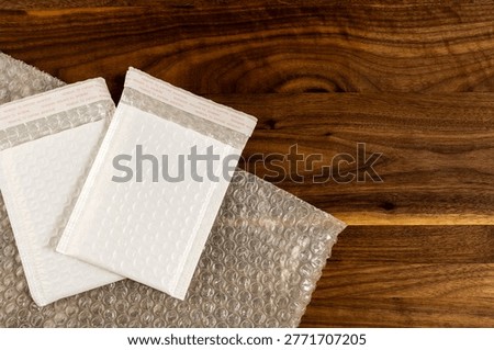 Flat Lay of Packing Materials with Bubble Wrap and Padded Envelope 