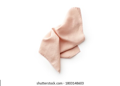 Flat lay with peach-colored linen kitchen napkin isolated on white background. Folded cloth for mockup