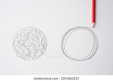 Flat lay of pencil hand drawing line chaos to order circle on paper background. Concept of abstract business management strategy, reorganize, problem solving solution, psychology mental health.