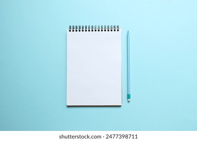 Flat lay with pencil and notebook on color  background, top view