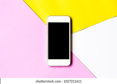 Flat Lay Phone Blank Screen And Flowers On Top View,background In Pastel Colors.clipping Path Inside