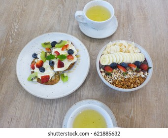 Flat Lay Photo Of Healthy Vegan Breakfast On Wooden Table