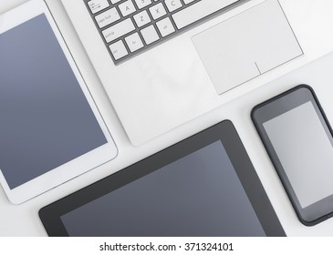 Flat Lay Photo Of Laptop, Digital Tablets And Smartphone