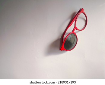 Flat Lay Photo Of Red Broken Glasses Isolated Over White Background