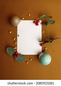 A Flat Lay Photo With Whitespace And Christmas Decorations Where Someone Can Add Their Own Message On The Card. Yellow Background, No People, Vertical Image