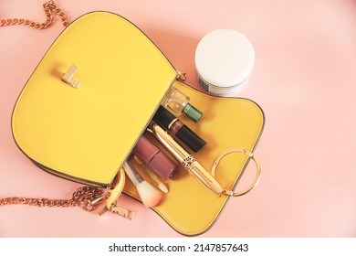 Flat Lay Of Pink Leather Woman Bag Open Out With Cosmetics And