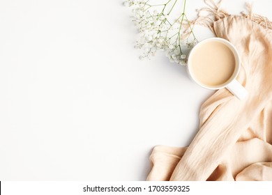 Flat lay plaid and cup of coffee on white desk. Hygge, autumn cozy mood, comfort concept. Flat lay, top view - Shutterstock ID 1703559325