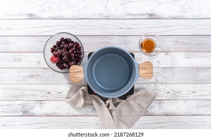 Flat Lay. Preparing Mixed Berry Compote From Frozen Berries In A Nonstick Cooking Pot.