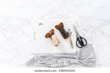 Flat lay. Preparing raw lobster tails to make garlic lobster tails.