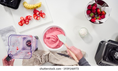 Flat lay. Preparing strawberry and banana smoothie in the kitchen blender. - Powered by Shutterstock