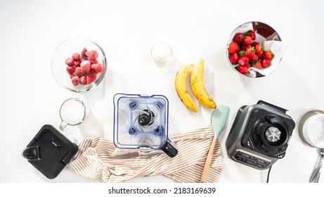 Flat Lay. Preparing Strawberry Banana Smoothie Bowl In A Kitchen Blender.