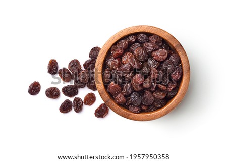 Flat lay of Raisins in wooden bowl isolated on white background.