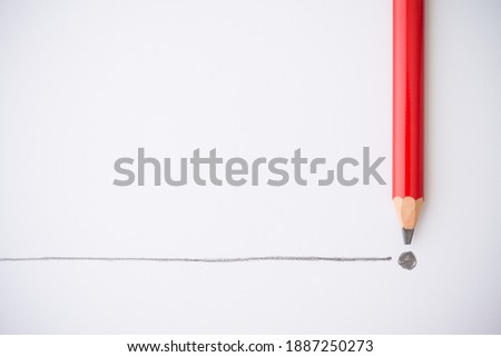 Flat lay of red colour pencil write line and end point on white paper background copy space. Business conclusion, creative idea, imagination and education concept.