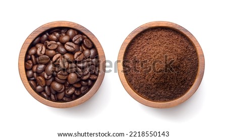 Flat lay of Roasted Coffee beans and ground coffee in wooden bowl isolated on white background. Clipping path.