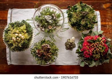 Flat lay of rustic wildflower table decorations arranged on cake platters.  