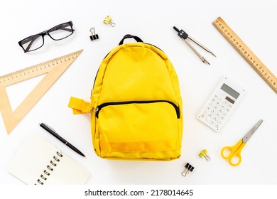 Flat Lay Of School Backpack With School Items And Student Accessories, Top View.