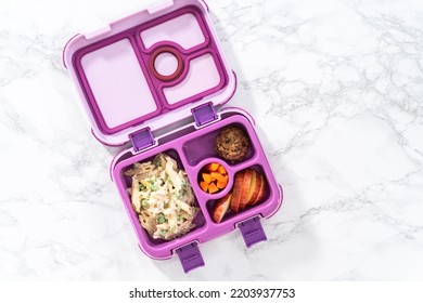 Flat Lay. School Lunch Bento Box With Macaroni Salad With Chicken And Apples.