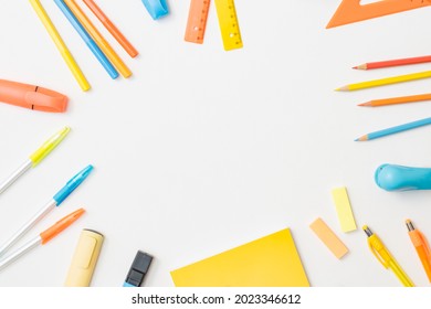 Flat lay school and office supplies on a white background - Shutterstock ID 2023346612