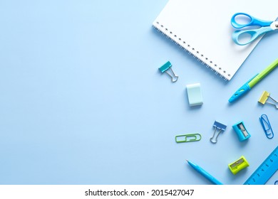 Flat Lay School Stationery On Blue Desk Table. Top View, Overhead. Back To School Concept.