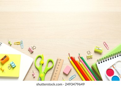 Flat lay with school stationery on wooden background, top view - Powered by Shutterstock