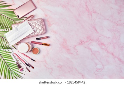 Flat Lay With Set Of Decorative Cosmetics, Makeup Tools, Disposable Protective Medical Mask And Feminine Accessories. Beauty Blog, Fashion, Party And New Normal Concept. View From Above