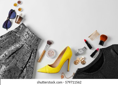 Flat Lay Set Of Female Clothes And Accessories On White Background