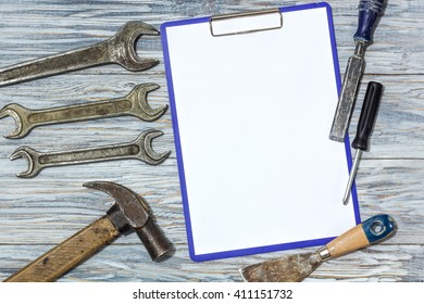 Flat lay: set of tools on a wooden background, copyspace
