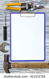 Flat lay: set of tools on a wooden background, copyspace