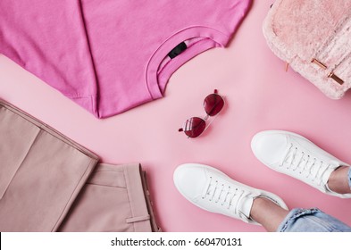 Flat Lay Shot Of Female Pastel Pink Clothing With Feet