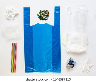 Flat Lay Shot Of Single Use Plastic Products With Non Reusable Or Non Recyclable Waste Products On White Background With Plastic Bag Bubble Wrap Disposable Diaper Nappy Cotton Buds 