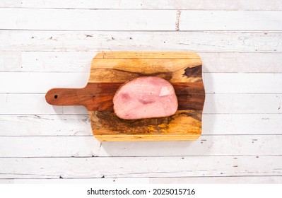 Flat Lay. Slice Of Organic Honey Ham On A Wood Cutting Board.