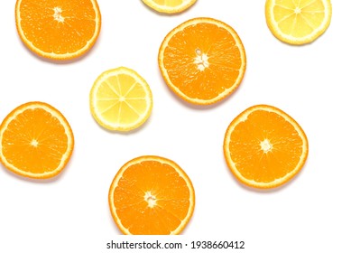 Flat Lay Slices Of Orange And Lemon Isolated On White Background. Top View