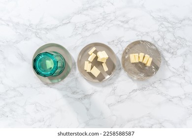 Flat lay. Softened sticks of unsalted butter on the counter. - Shutterstock ID 2258588587