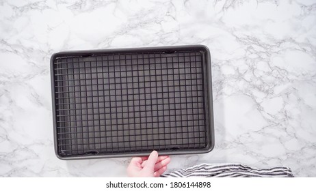 Flat Lay. Step By Step. Empty Cookie Tray With Drying Rack On A Marble Kitchen Surface.