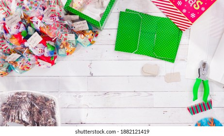 Flat lay. Step by step. Packaging homemade macadamia fudge into small gift bags.